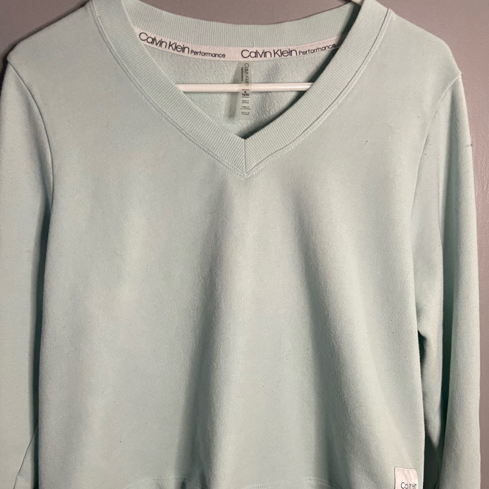 Calvin Klein blue top.